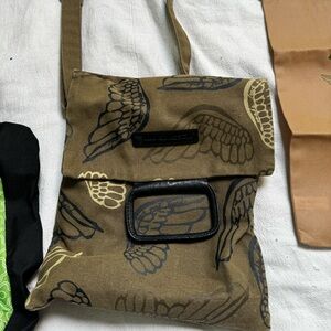 Super Cute crossbody with dust cover.